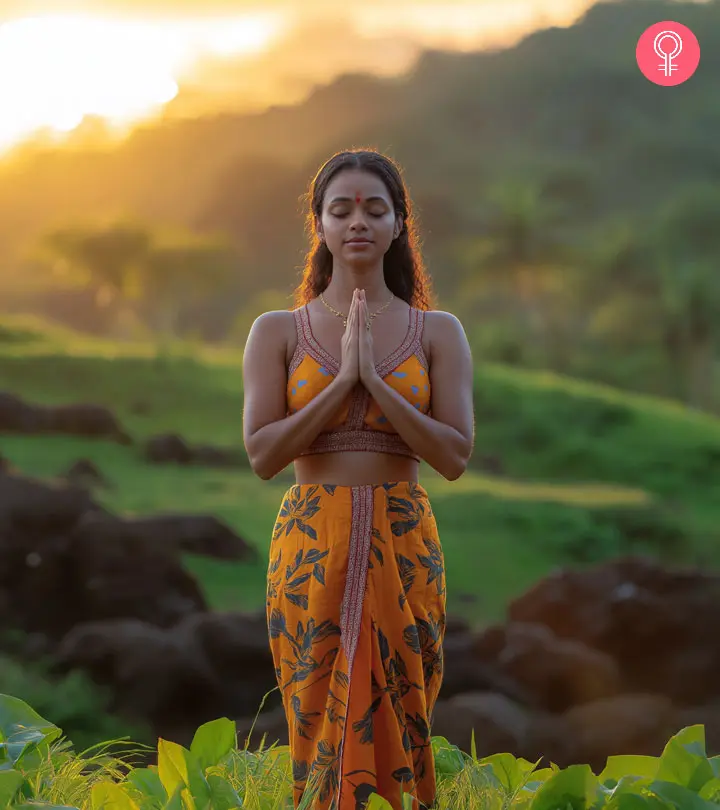 A woman doing surya namaskar for weight loss