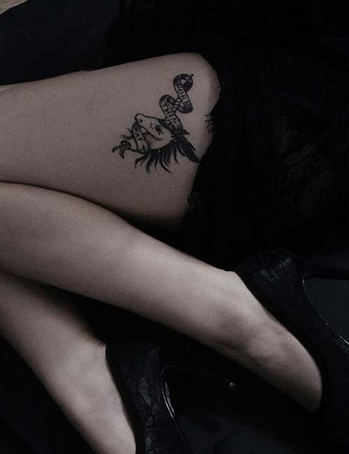 Lady Gaga Unicorn tattoo on thigh