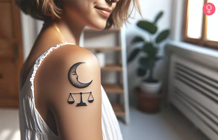 A woman with a Libra and moon tattoo on her shoulder