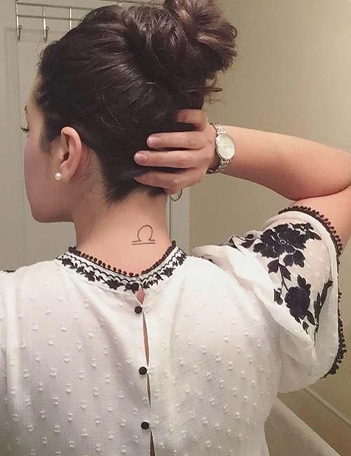 A stylish libra neck tattoo