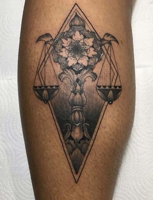 An intricately designed tattoo for the libras
