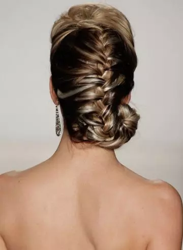 Puffy French bride hairstyle with spiral end