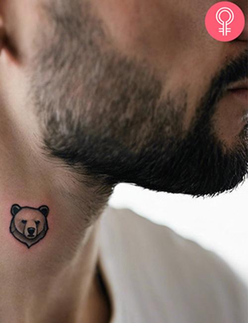Simple bear tattoo on the neck of a man