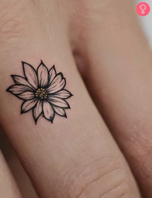 Simple flower tattoo on the finger