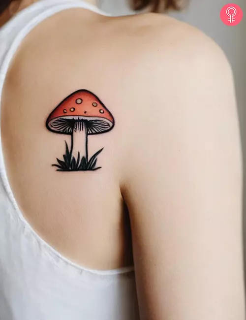 Simple mushroom tattoo on the back of the shoulder