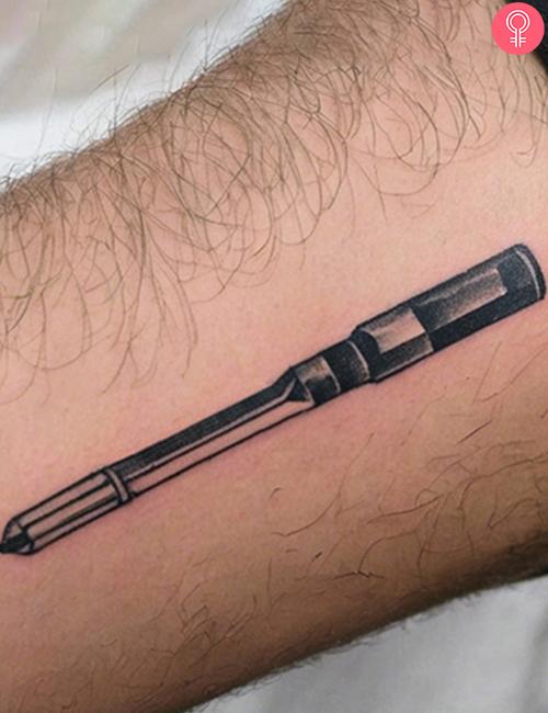 Simple screwdriver tattoo on the forearm of a man