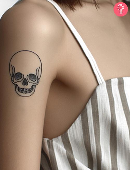 Simple skull tattoo on the forearm
