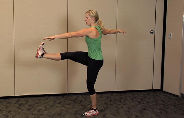 Standing cross kick to lose excess hip fat
