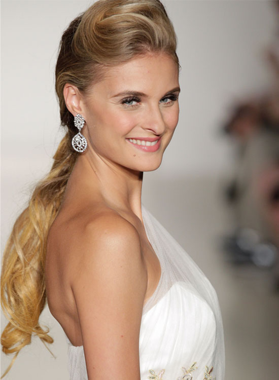 Textured low pony with twisted pouf hairstyle for bride