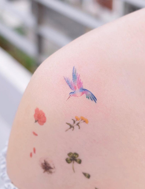 Tiny bird tattoo design