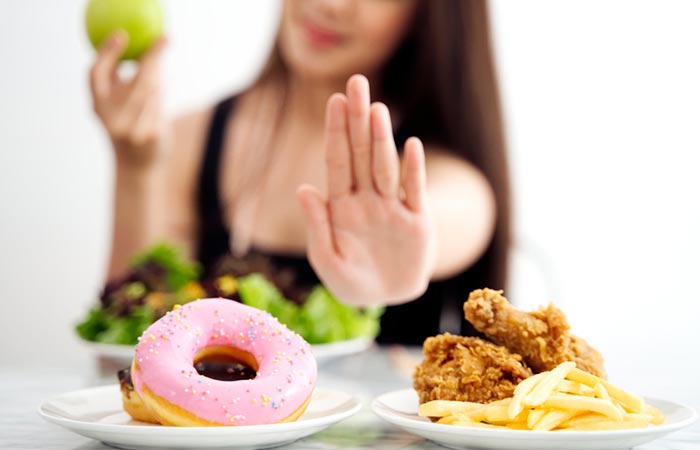A woman rejects junk food and chooses the healthier option