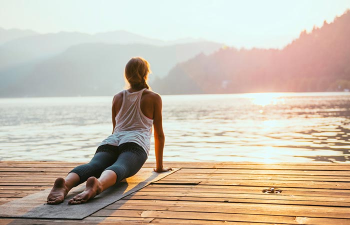 Woman following Surya Namaskar tips while performing it