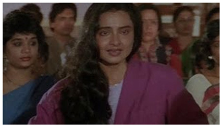 Rekha in her trademark hairstyle without makeup