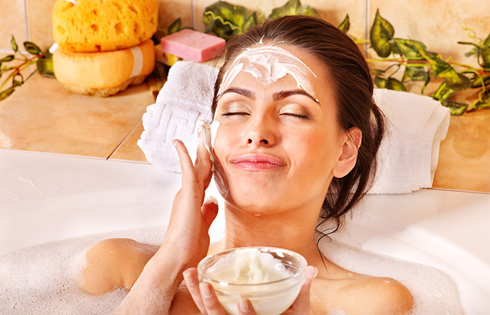 Woman applying DIY honey face mask with natural ingredients 