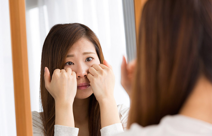 Woman worrying about her swollen up face