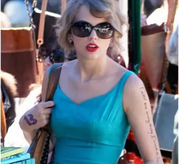 Taylor Swift tattoo on the left arm