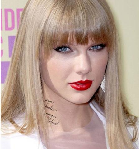 taylor swift tattoo on arm what does it say