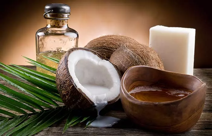 Warm coconut oil massage to prevent hair fall in summer