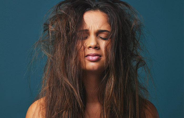 Woman with rough and frizzy hair due to hard water
