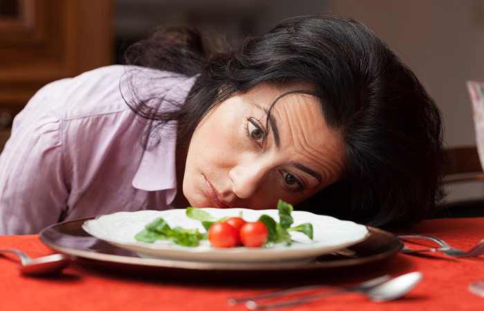 Woman looking sick and tired because of crash dieting.