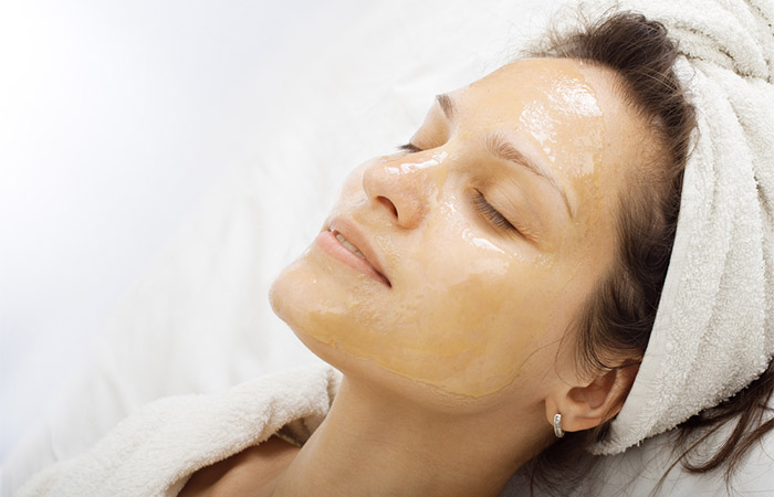 Woman relaxing with honey on her face for dry skin
