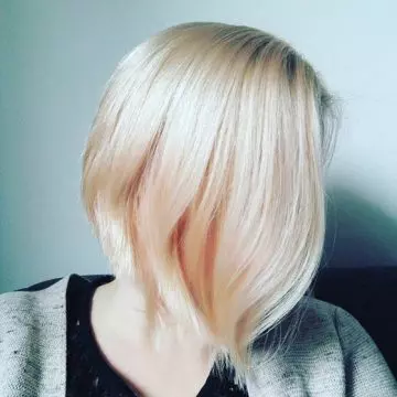 Blush blonde hair color ideas to create a combination of gold highlights and mild red undertones for bob cut hair