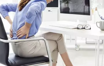 Woman experiences backache due to bad posture