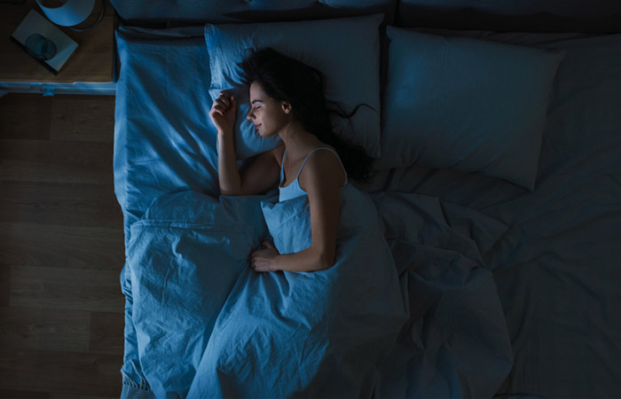Woman sleeping blissfully at night