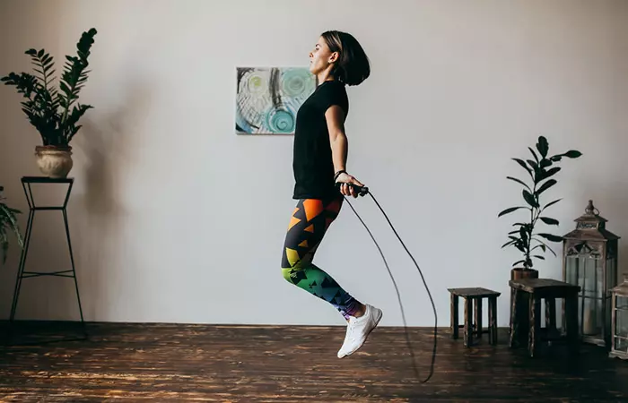 Woman skipping in her house