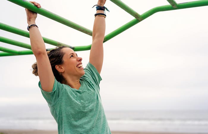 Woman does hanging exercise to increase height