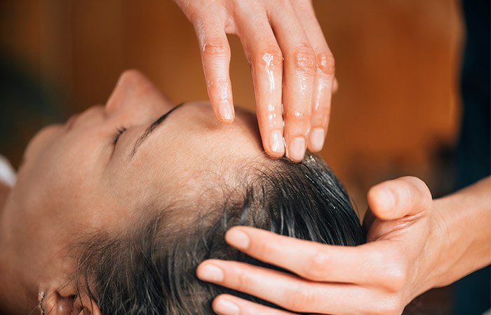 Oil massage is a natural treatment for strong hair