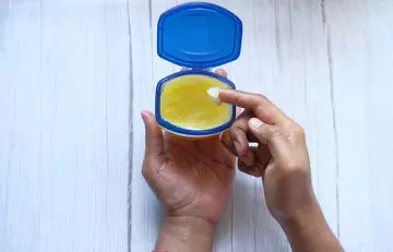 Petroleum jelly to moisturize peeling fingertips