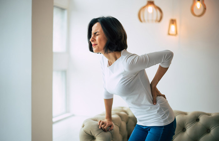 Woman with chronic back pain experiences a backache unexpectedly