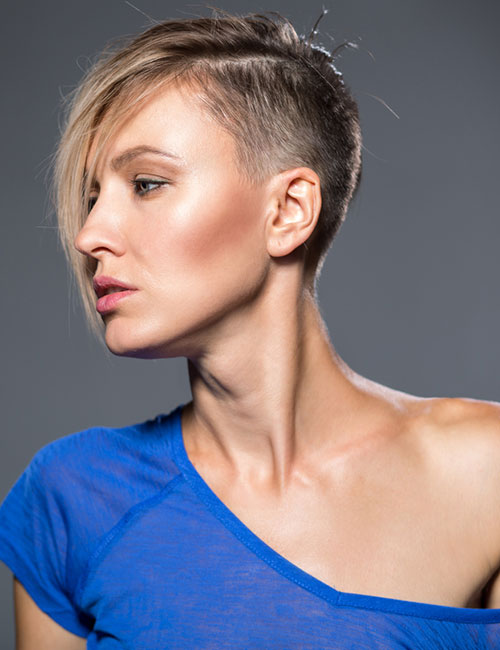 Undercut bob haircut with bangs that swept towards the sides