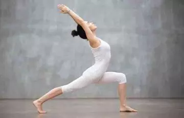 Young woman practicing yoga to increase her appetite