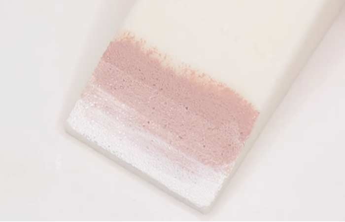 Step 5 of the ombre nails process is applying the nude or flesh-toned nail polish to the sponge