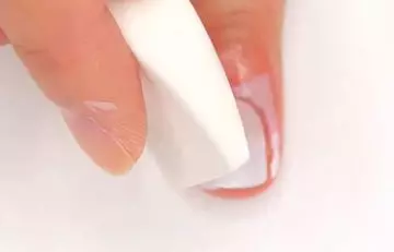 Step 6 of the ombre nails process is dabbing the sponge onto the nail