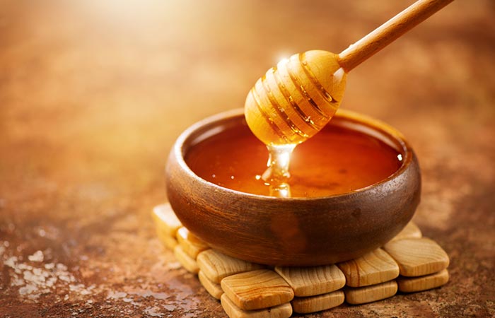 Honey in a wooden bowl for glowing face