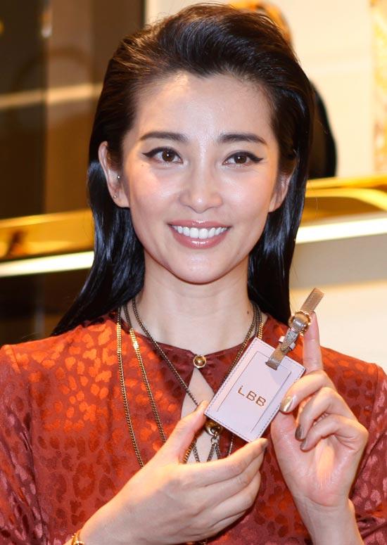 portrait of sexy asian woman with long hair, stylish earrings