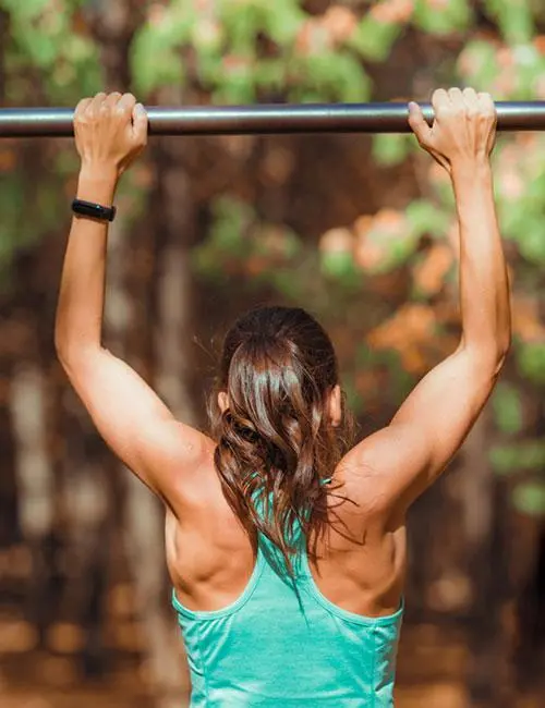 A woman doing a perfect pull-up