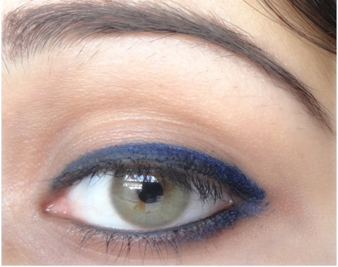 Step 6 of applying blue eyeliner