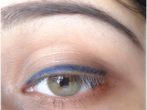 Step 2 of applying blue eyeliner