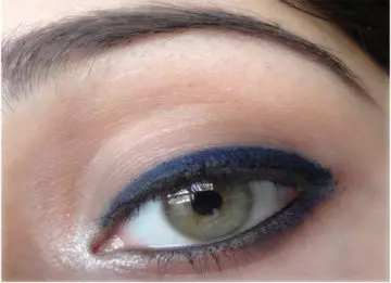 Step 7 of applying blue eyeliner