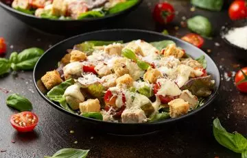A plate of vegetarian Caesar salad with meat free chicken