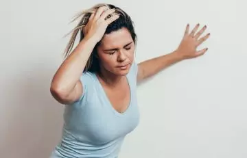 Woman feeling dizzy due to senna side effect