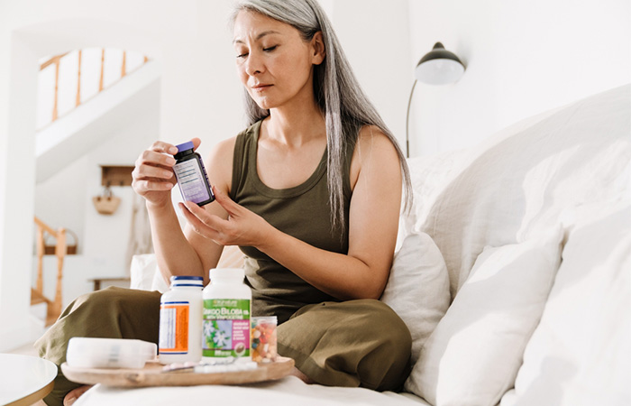 Woman taking excess nutritional supplements