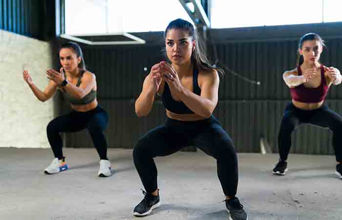Three women performing HIIT workout