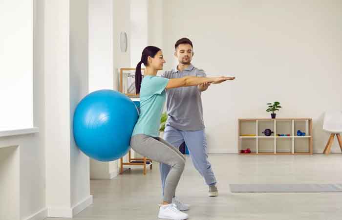 Wall sit with stability ball