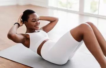 Woman doing crunches as a core strengthening exercise