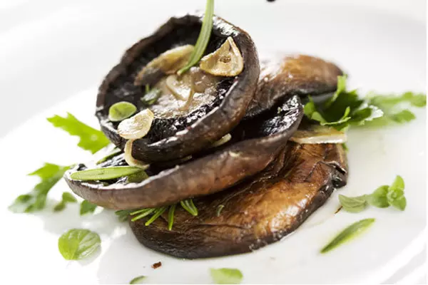 Grilled portobello mushrooms with tarragon parsley butter